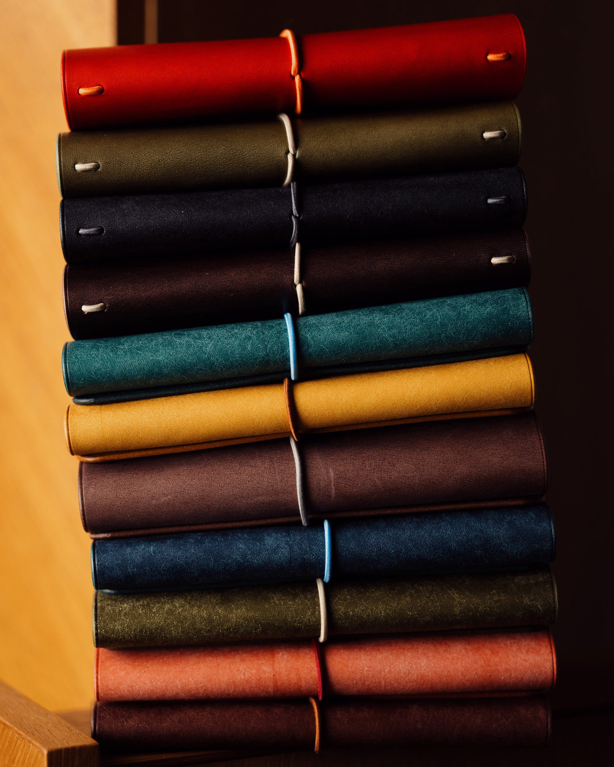 The SLOWLINES autumn 2026 range stacked on a shelf, every new colour visible