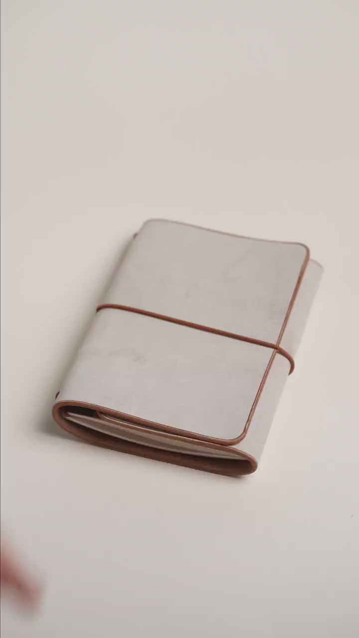 Light brown Ghost Wax A6 trifold cover wrapped closed