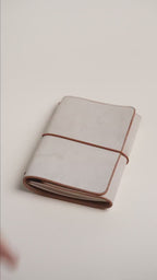 Light brown Ghost Wax A6 trifold cover wrapped closed