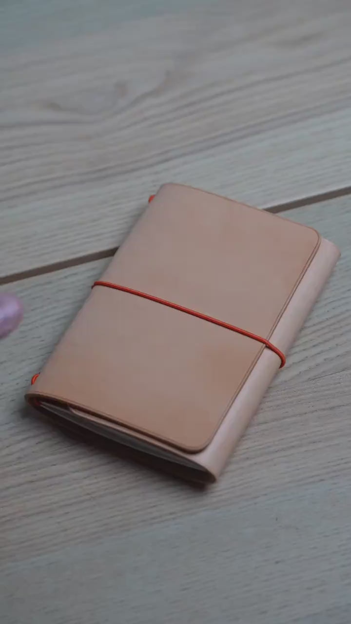 Natural Buttero trifold cover wrapped around a notebook