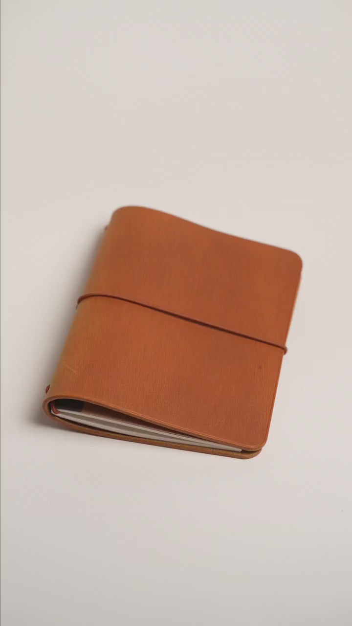 Ginger pull-up A6 cover, colour lifting pale where the leather bends