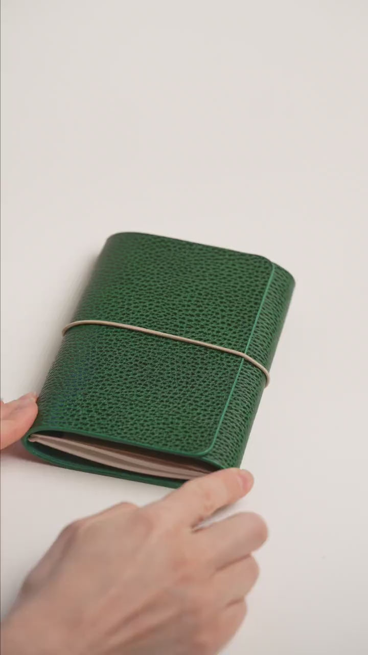Green Dollaro A6 trifold cover, flap folded over the fore-edge