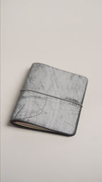 Black Ghost Wax A6 cover, pale frosted wax over a deep black hide