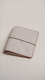 Light brown Ghost Wax A6 cover, frosted layer over warm brown leather