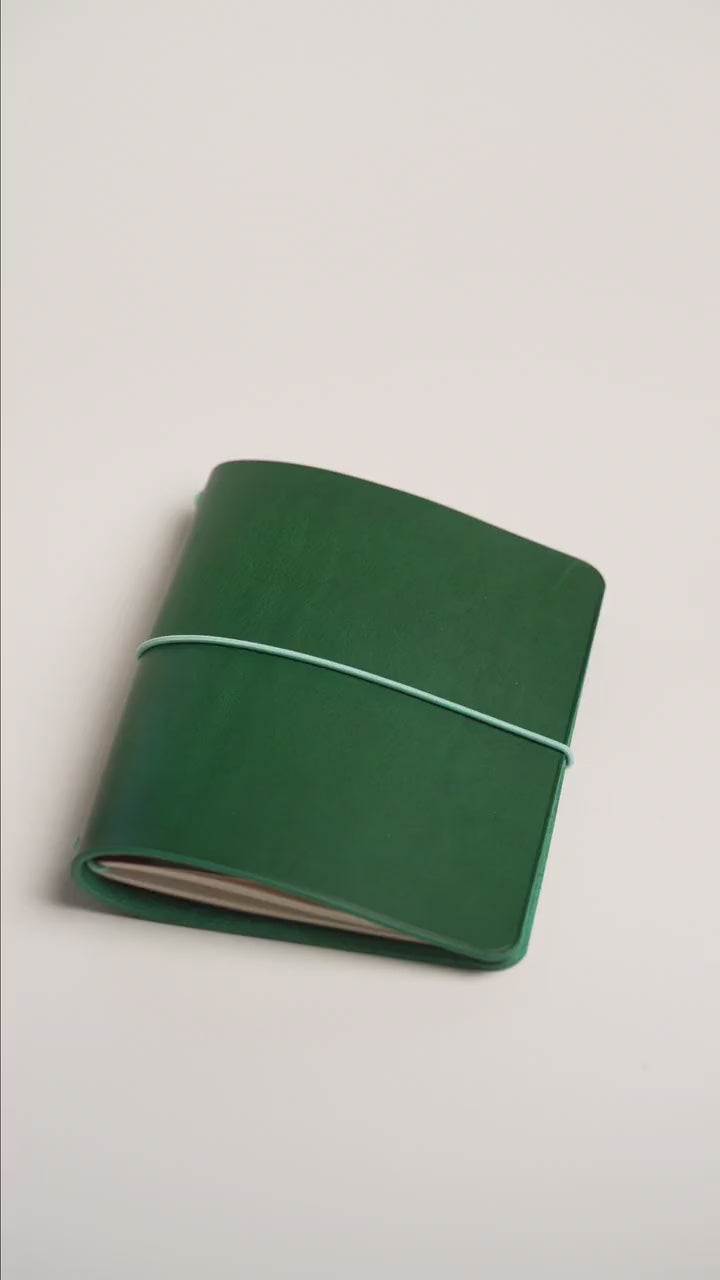 Green Buttero A6 trifold cover, the finished piece in the workshop